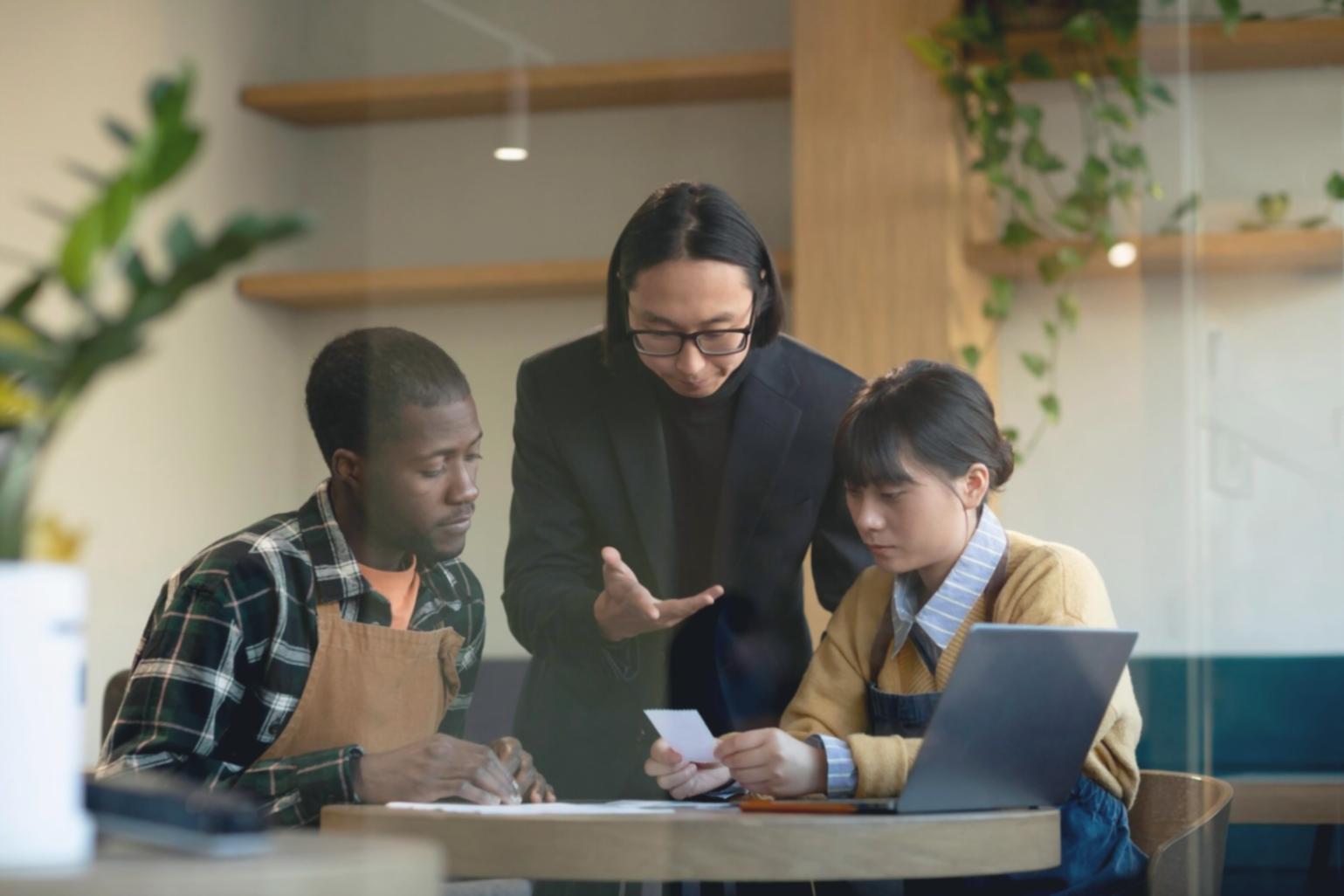 Team reviewing comprehensive financial reports with client